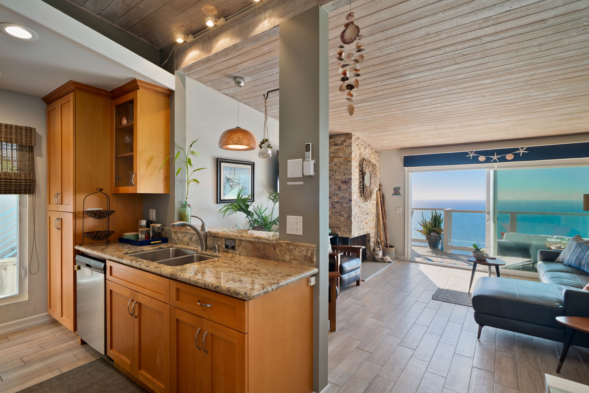 Gourmet kitchen with quartz countertops and ocean views at Dana Point condo