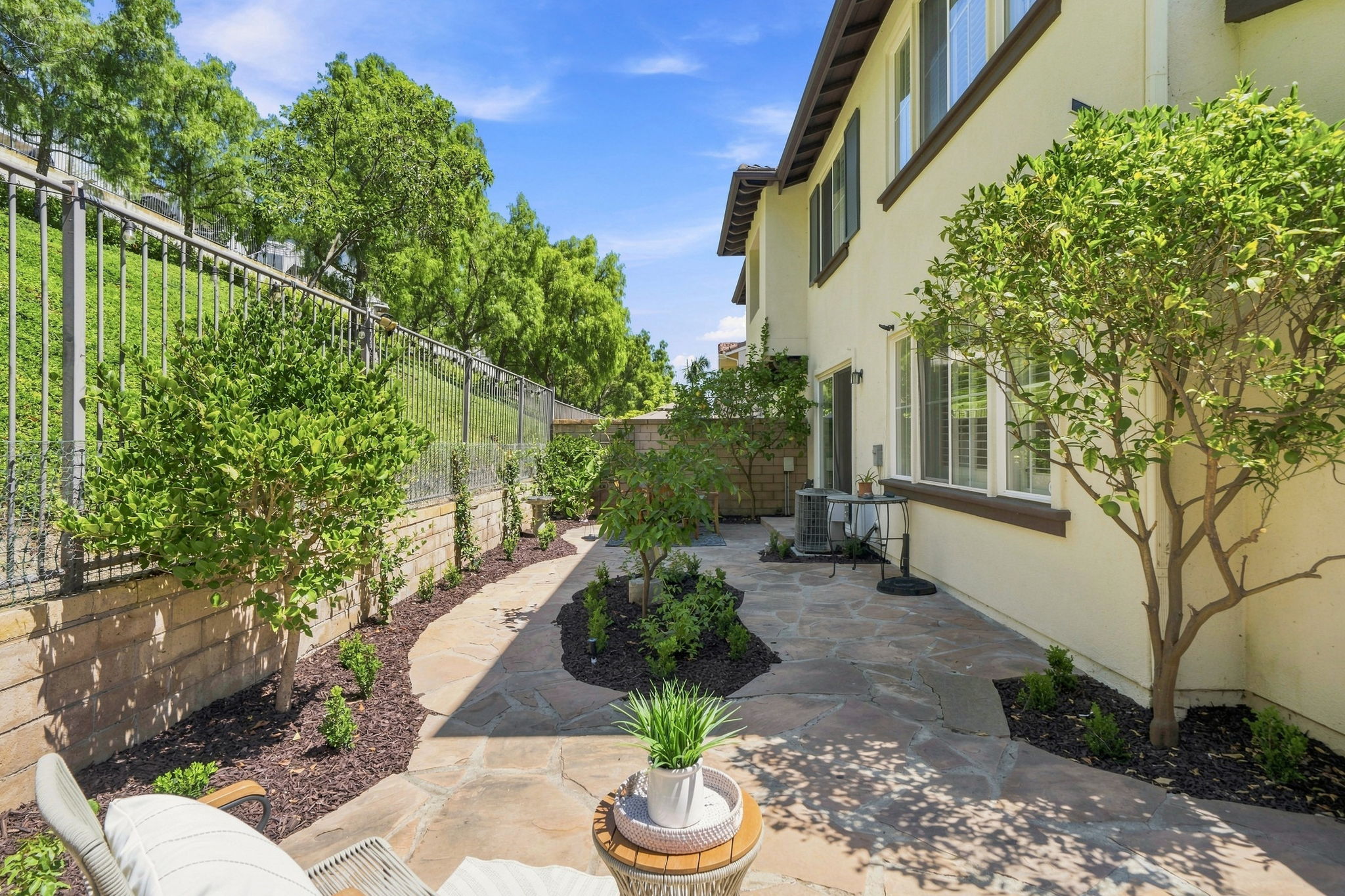Private backyard with flagstone patio backing to greenbelt in Talega, San Clemente